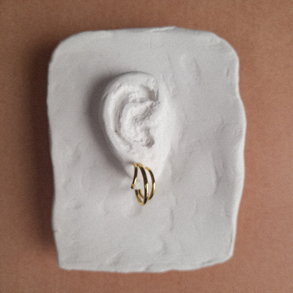 Gouden oorbellen ringen